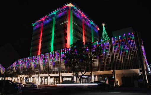 office building decorated with multicolor LED christmas lights