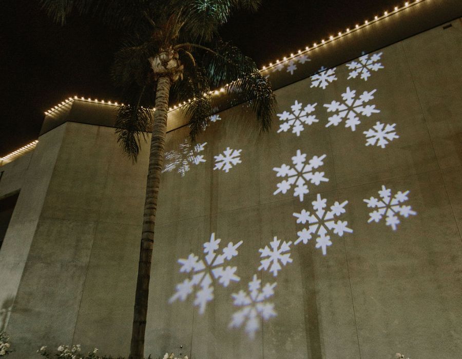 retail business with snowflake projector and warm white LED lights